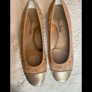 Stylish Flat shoes made out of cork with metallic gold toe overlay.